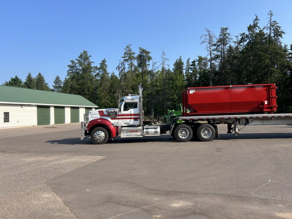 20 Yard Dumpster on the flatbed of a truck.