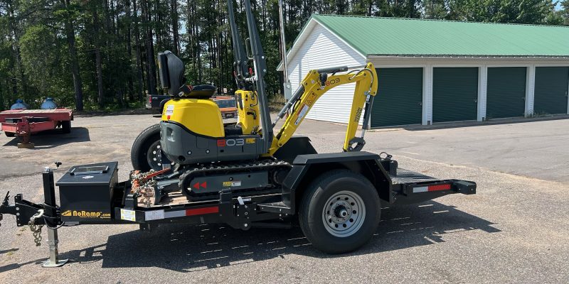 Wacker Neuson 803 Mini Excavator on a flatbed truck