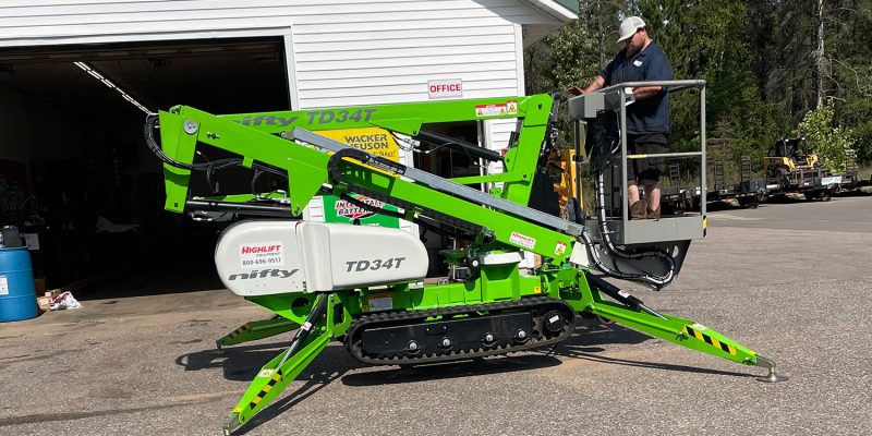 The Nifty TD34T Track Driven Man Lift retracted down to the ground.